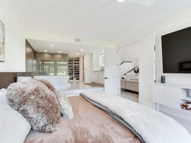 a living room with furniture and kitchen view