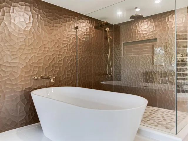 a kitchen with stainless steel appliances granite countertop a sink a stove a refrigerator cabinets and chairs