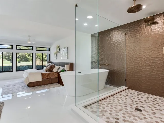 a kitchen with stainless steel appliances a stove sink microwave and cabinets