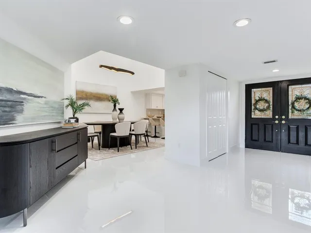 a kitchen with cabinets stainless steel appliances and sink