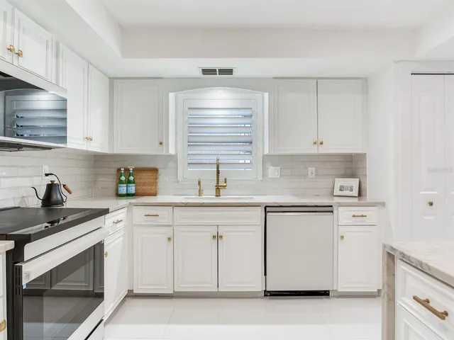 a bedroom with bed and a night stand