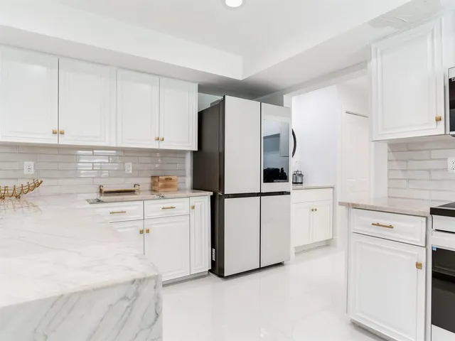 a bathroom with a shower toilet and sink