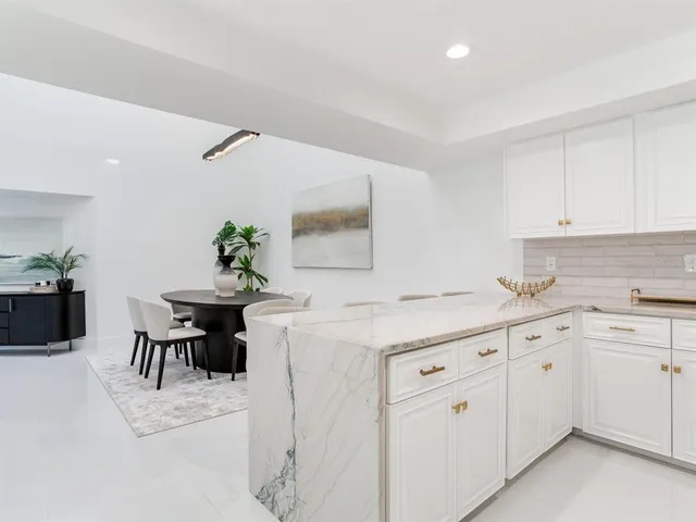 a bedroom with a bed and a television