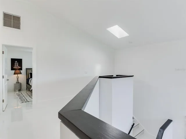 a bathroom with a double vanity sink mirror and toilet