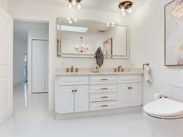 an aerial view of residential houses with outdoor space and swimming pool