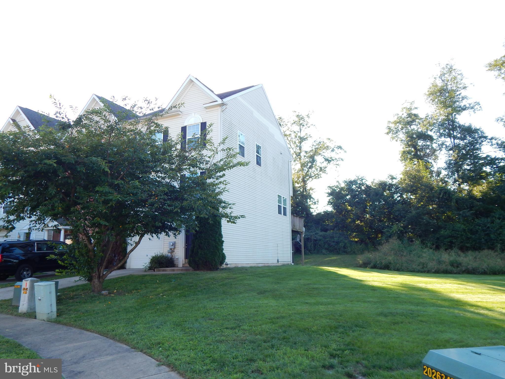 124 Raphael Court Martinsburg, WV 25403 - Photo 2 of 30 a front view of a house with garden
