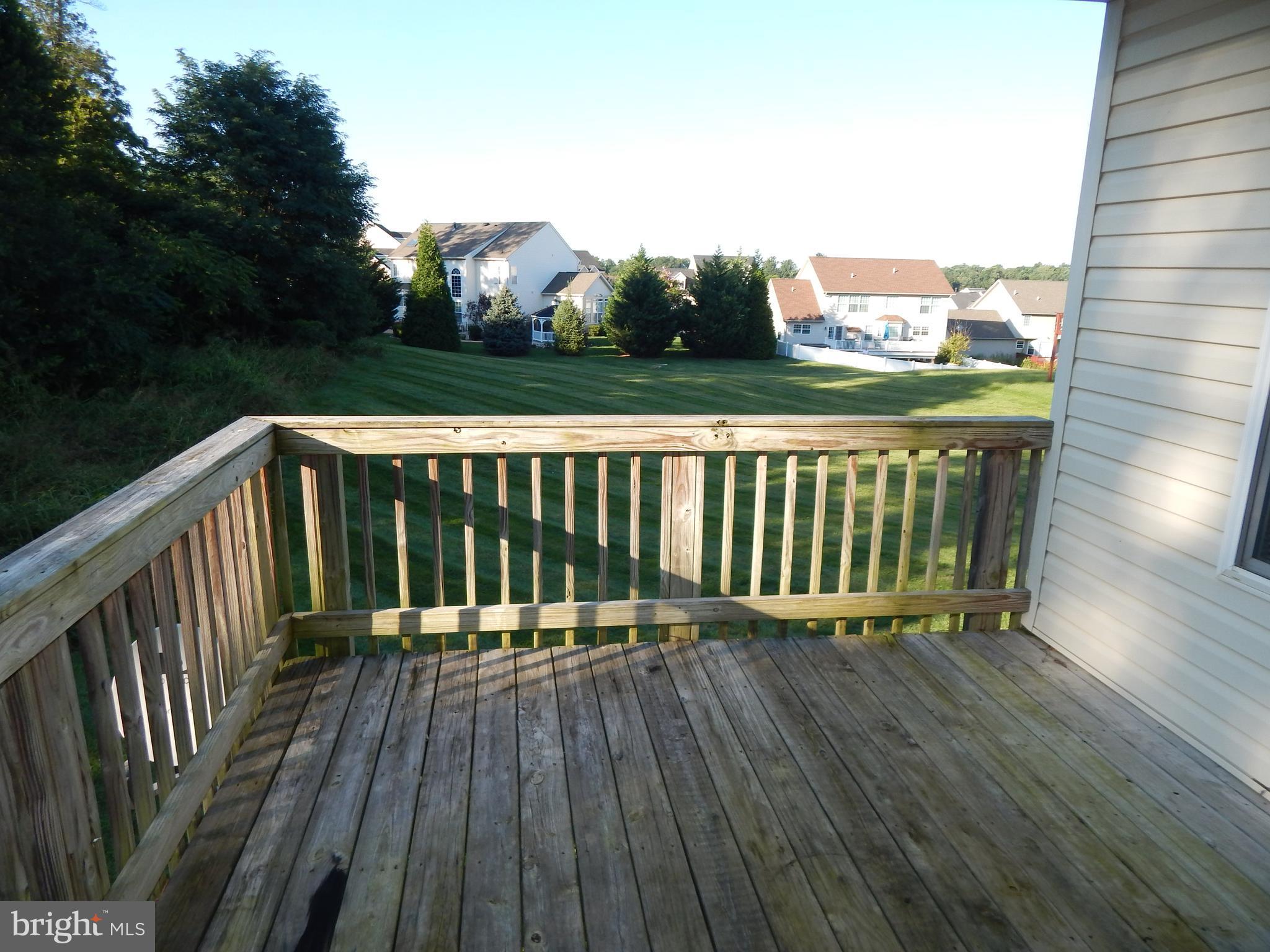 124 Raphael Court Martinsburg, WV 25403 - Photo 11 of 30 a view of balcony with wooden floor and fence