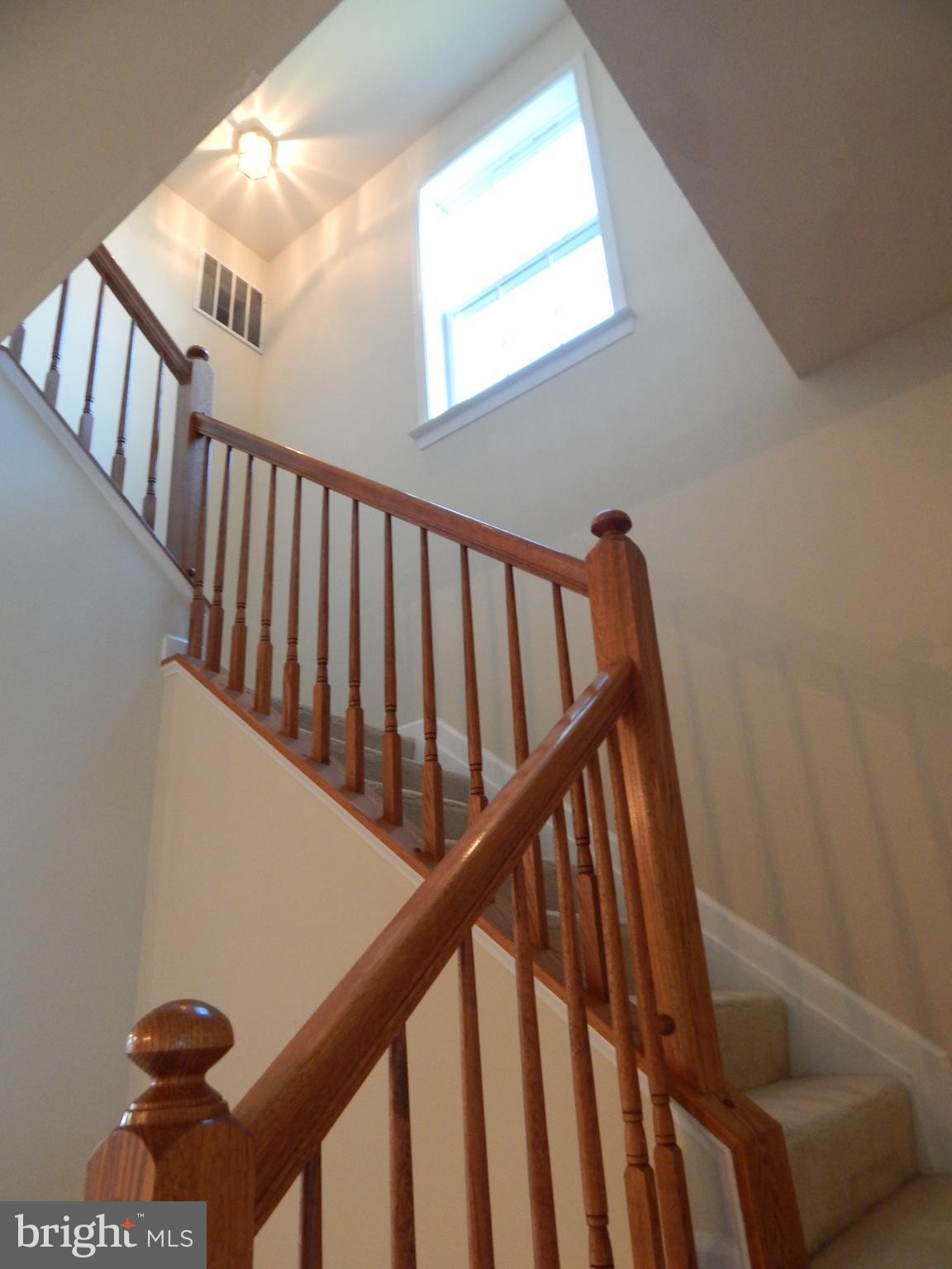 124 Raphael Court Martinsburg, WV 25403 - Photo 14 of 30 a view of staircase with lots of windows