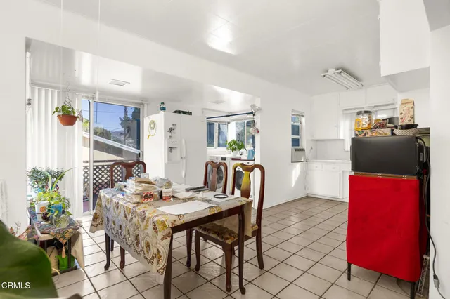 a kitchen with a stove a sink and a refrigerator