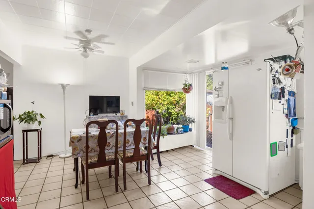 a kitchen with stainless steel appliances kitchen island granite countertop a sink and cabinets
