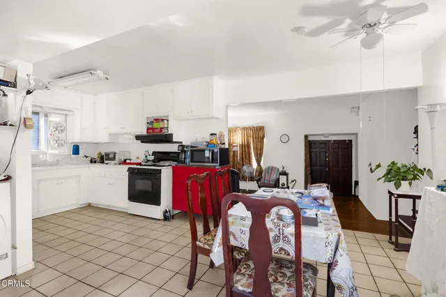 a living room with furniture a window and gym equipment
