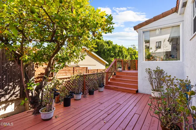 a view of a house with yard and utility room