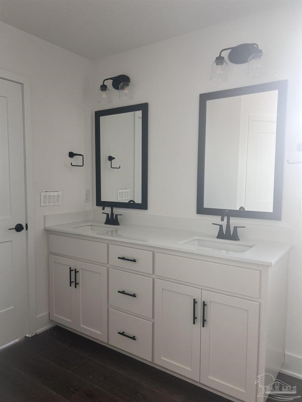 5232 Muscadine Way Milton, FL 32570 - Photo 12 of 23 a bathroom with a sink vanity and mirror