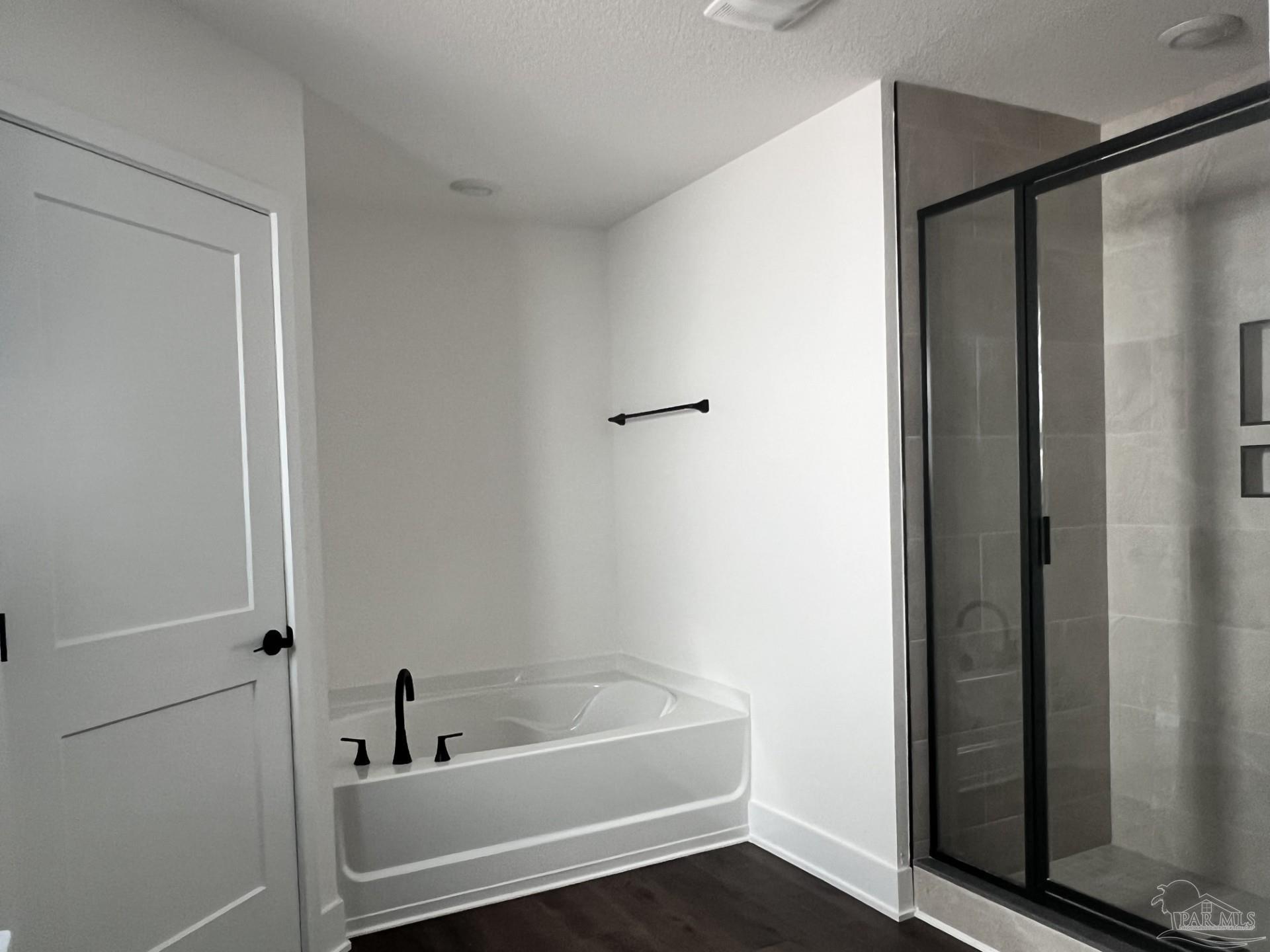 5232 Muscadine Way Milton, FL 32570 - Photo 13 of 23 a bathroom with a tub and shower