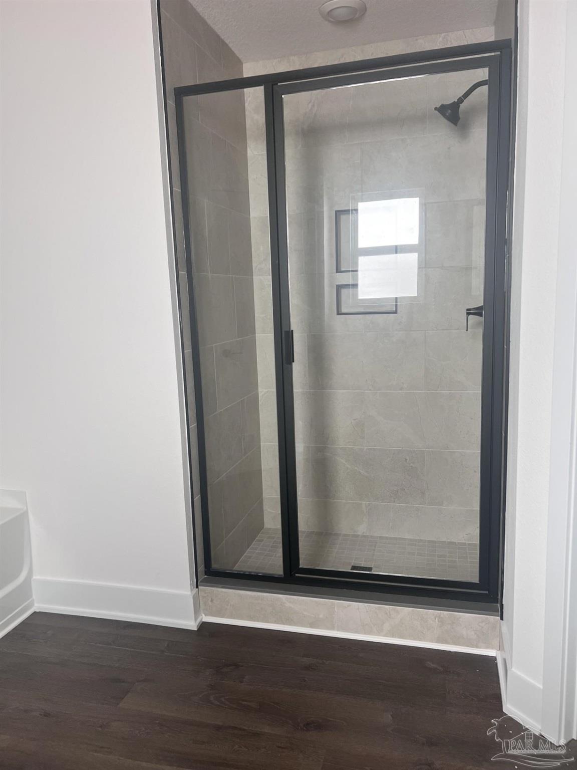 5232 Muscadine Way Milton, FL 32570 - Photo 14 of 23 a view of a small space with wooden floor and a window