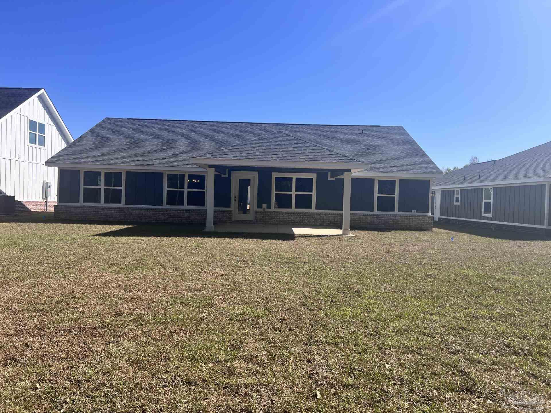 5232 Muscadine Way Milton, FL 32570 - Photo 22 of 23 a house view with a garden space