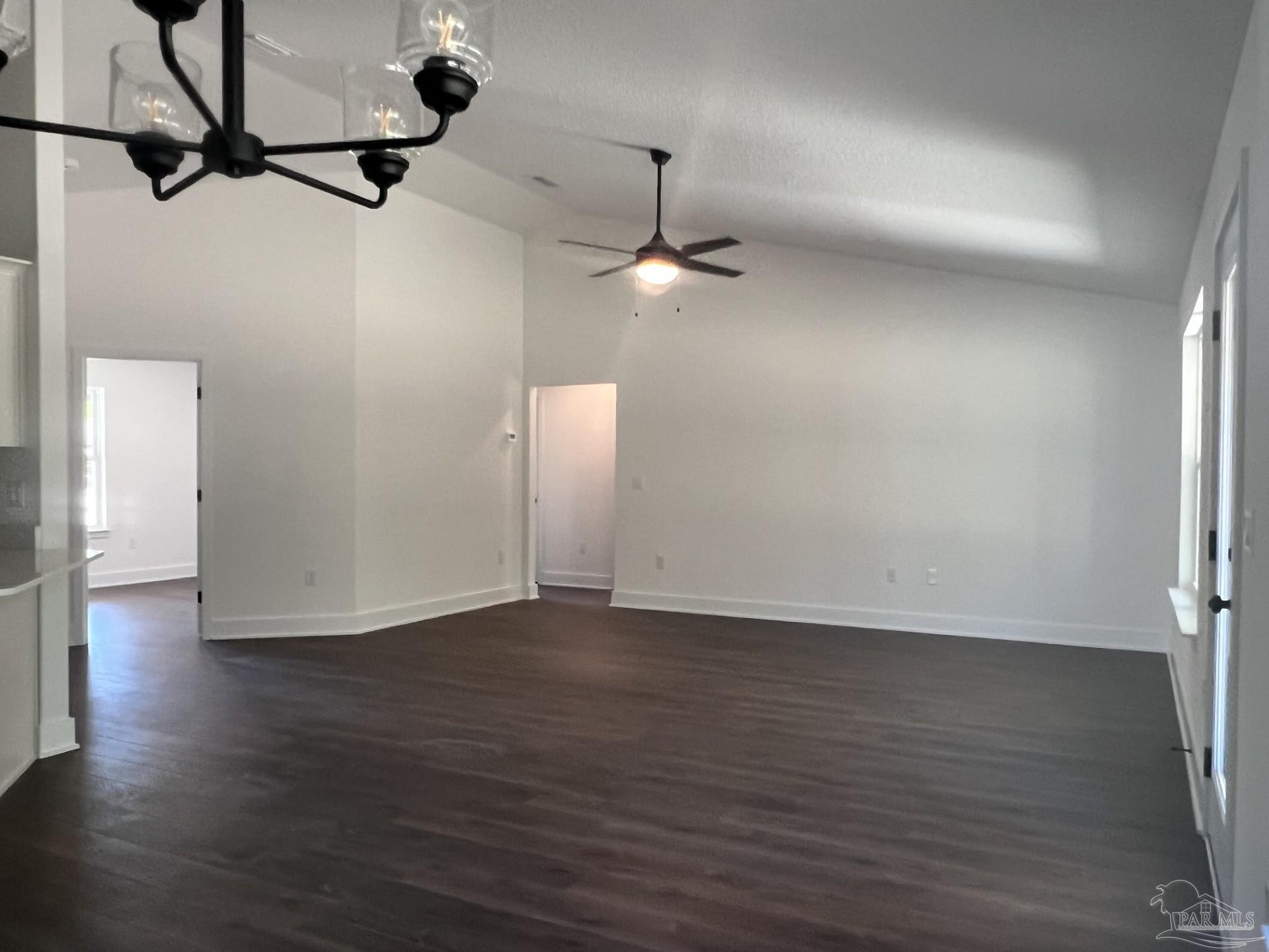 5232 Muscadine Way Milton, FL 32570 - Photo 8 of 23 a view of an empty room with wooden floor