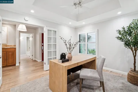 a work room with furniture and wooden floor