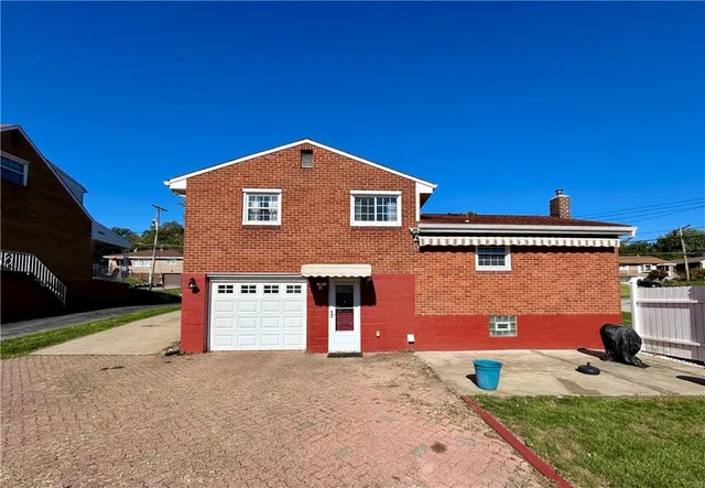 a view of a swimming pool with a yard