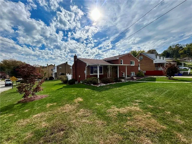 front view of a house with a yard