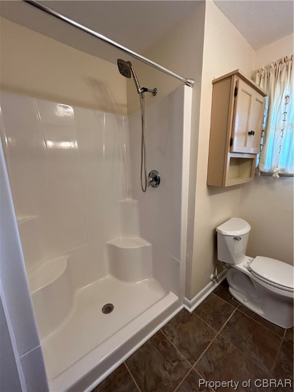 1489 Laurens Road Gloucester Point, VA 23062 - Photo 33 of 43 Hall Bathroom with tile floors, toilet, a textured ceiling, and a shower