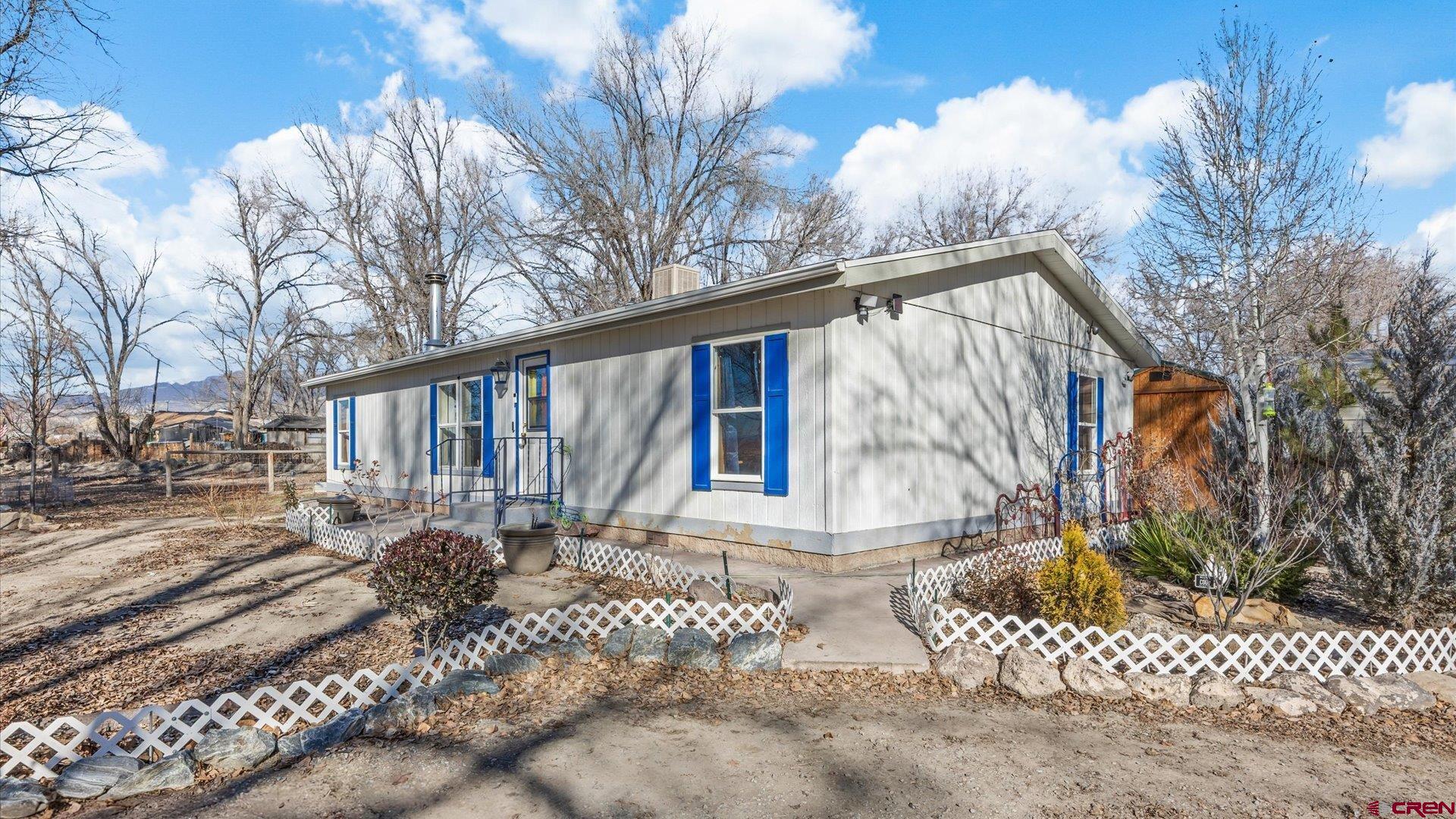 777 1550th Road Delta, CO 81416 - Photo 2 of 32 a view of a house with a yard