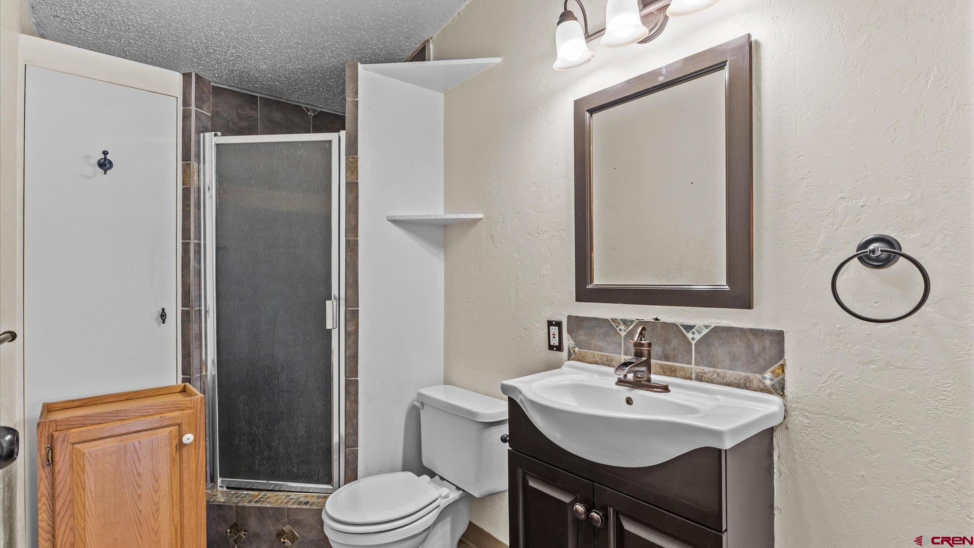 777 1550th Road Delta, CO 81416 - Photo 23 of 32 a bathroom with a sink toilet and mirror