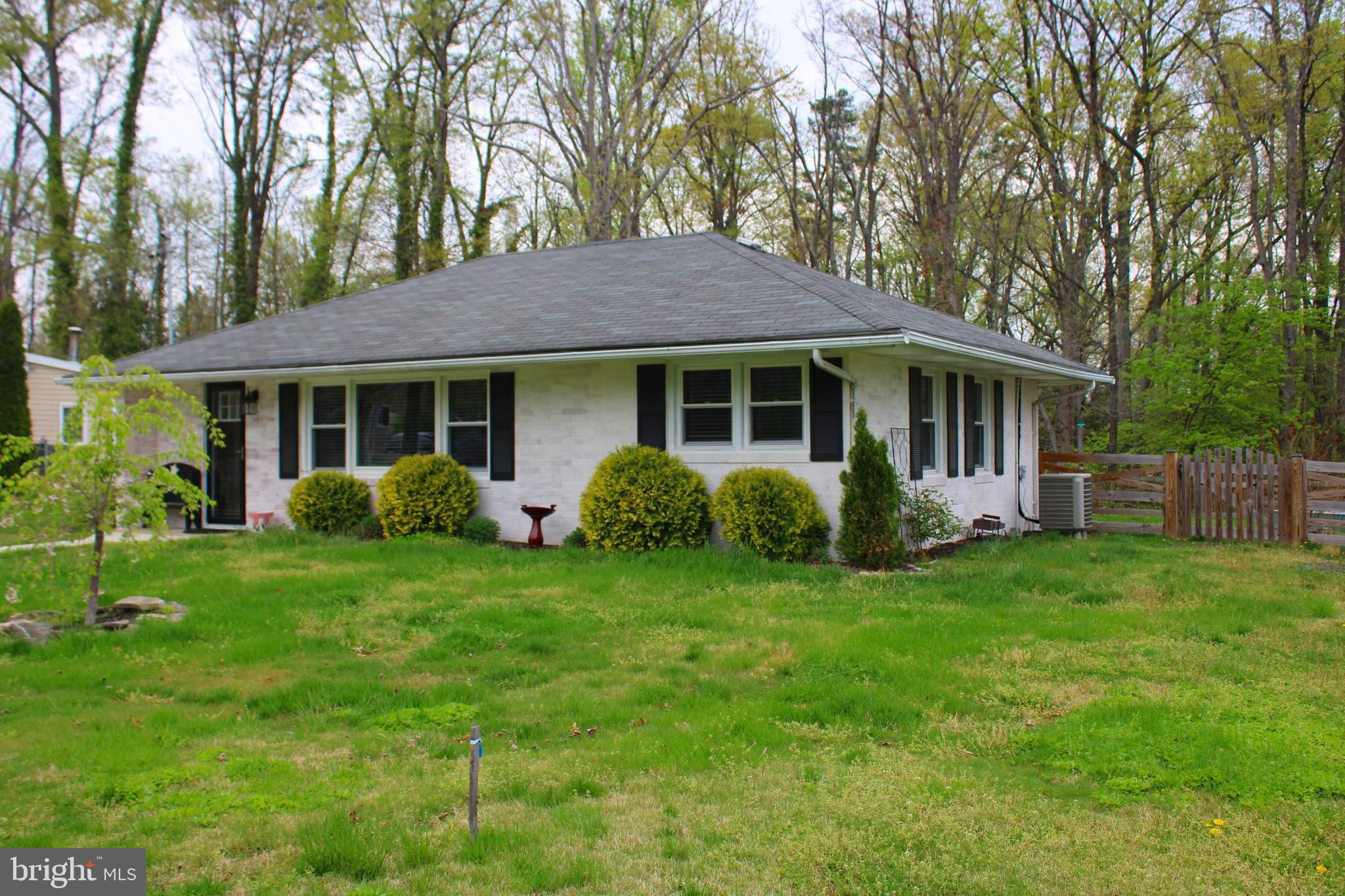 7802 Shelbourne Road Baltimore, MD 21226 - Photo 7 of 19 a view of a house with a backyard