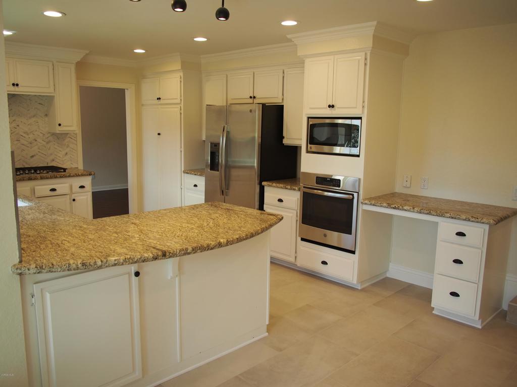 211 Windtree Avenue Thousand Oaks, CA 91320 - Photo 3 of 29 a kitchen with stainless steel appliances granite countertop a refrigerator and a stove