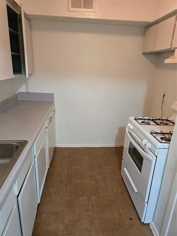 a kitchen with a stove and a microwave