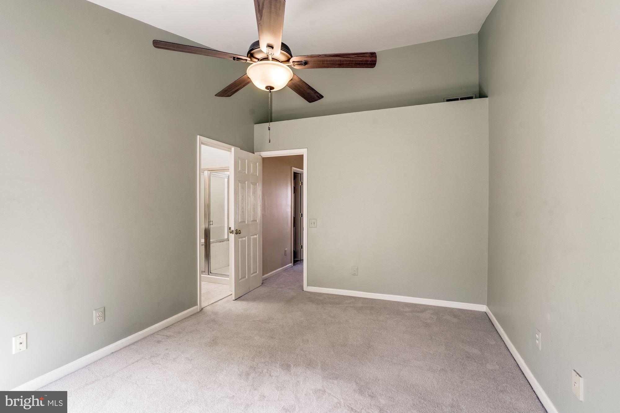 43315 Parlor Square Ashburn, VA 20147 - Photo 11 of 31 an empty room with a chandelier fan and a ceiling fan