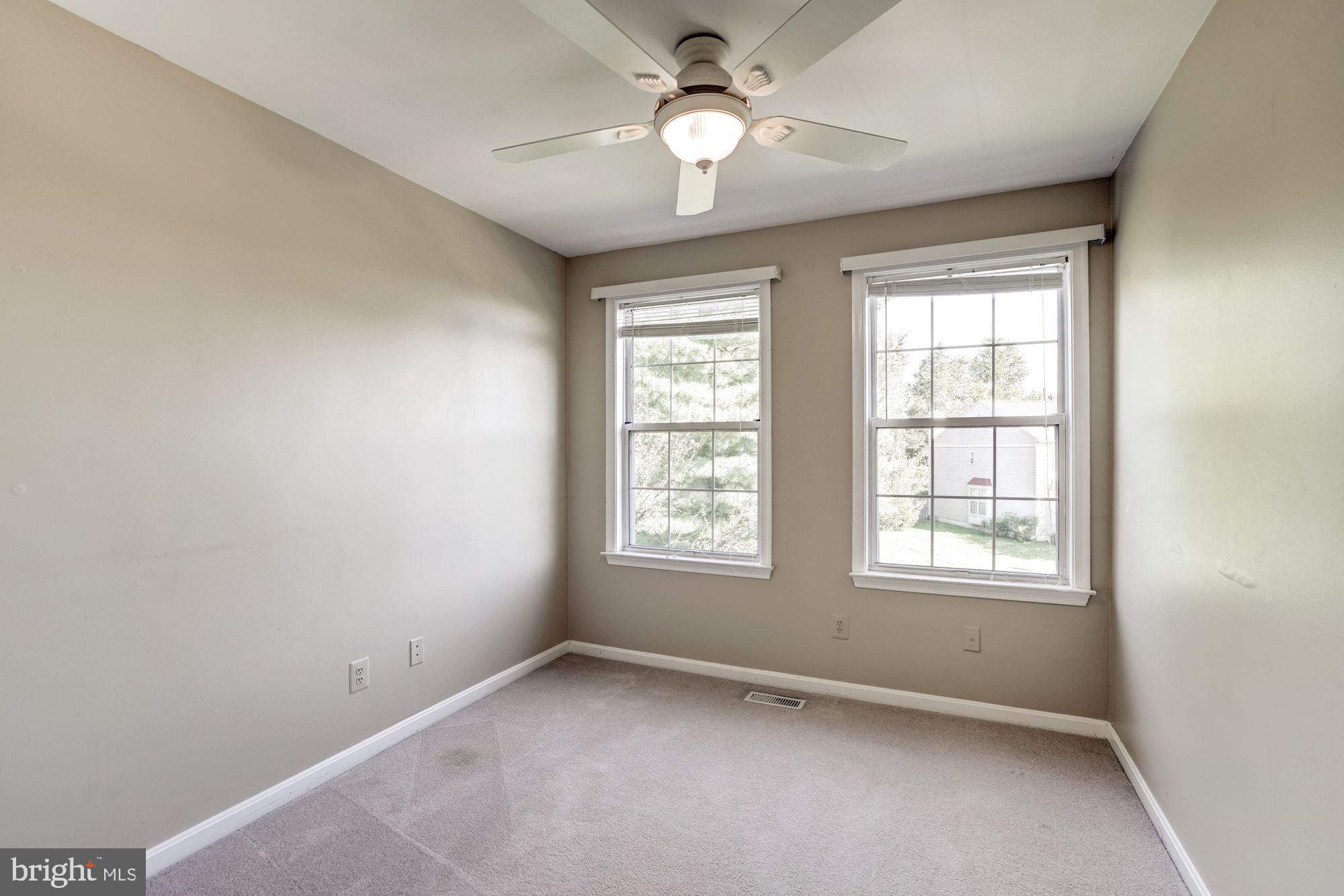 43315 Parlor Square Ashburn, VA 20147 - Photo 14 of 31 an empty room with a window and a fan