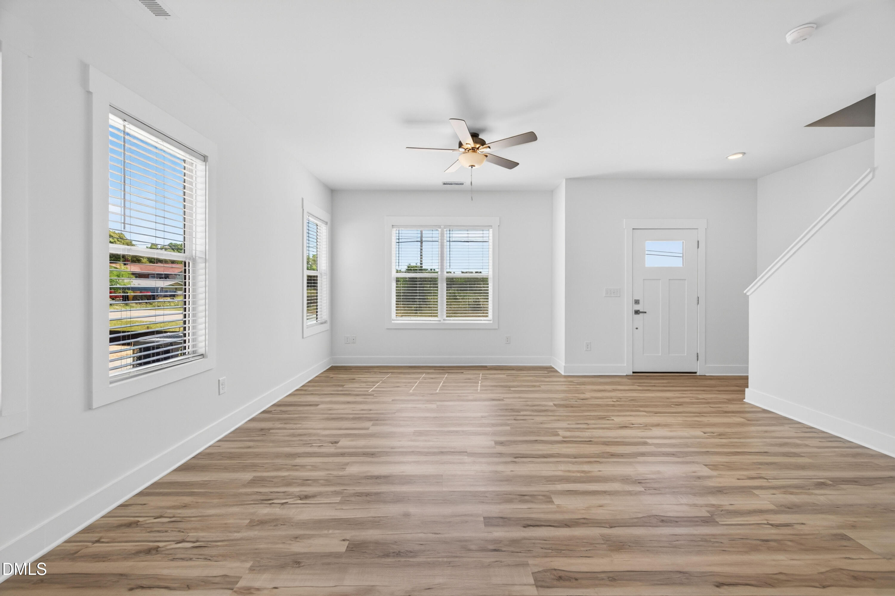 1256 Hurdle Mills Road Roxboro, NC 27573 - Photo 10 of 48 a view of an empty room with a window and a kitchen