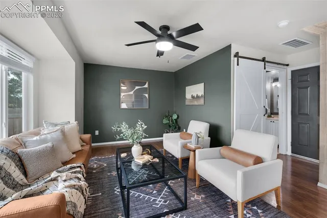 a living room with furniture and a window