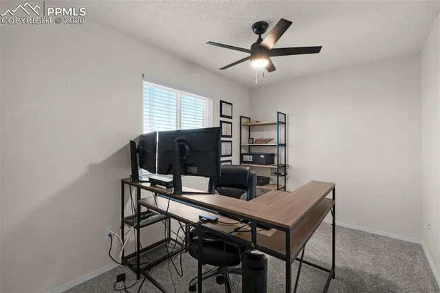 a view of a workspace with furniture