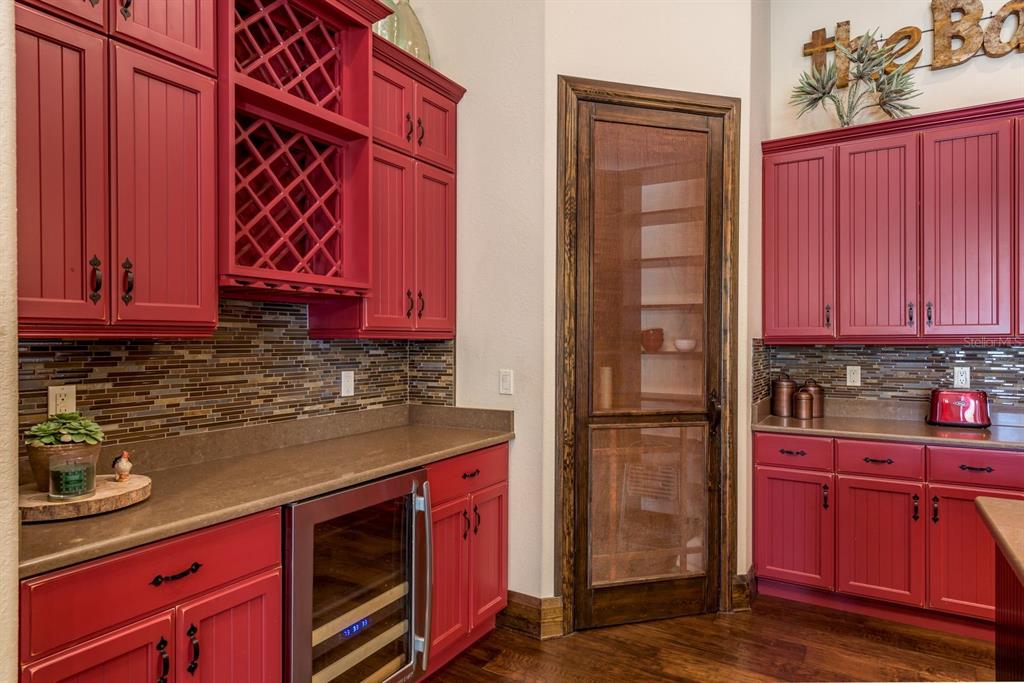 19018 Blake Road Odessa, FL 33556 - Photo 15 of 40 a kitchen with stainless steel appliances granite countertop a refrigerator and a stove top oven