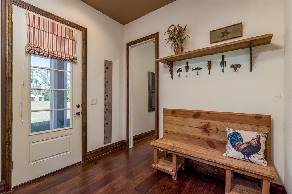 19018 Blake Road Odessa, FL 33556 - Photo 18 of 40 a view of room with furniture and wooden floor