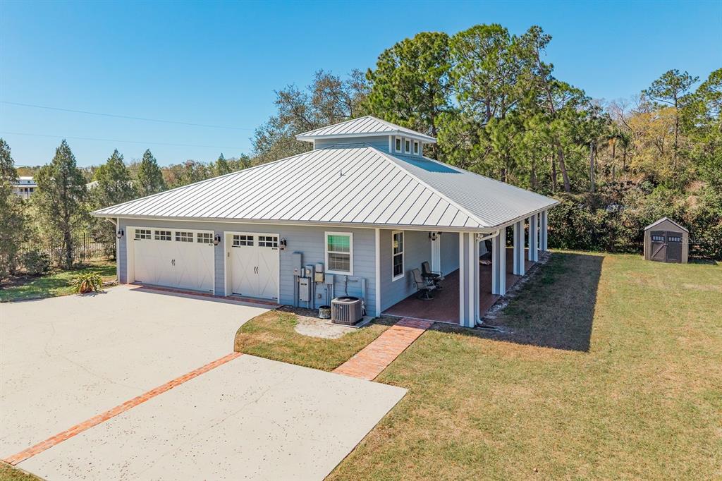 19018 Blake Road Odessa, FL 33556 - Photo 2 of 40 a view of a house with a yard and sitting area