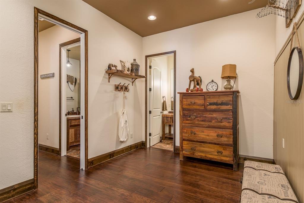 19018 Blake Road Odessa, FL 33556 - Photo 23 of 40 a view of a hallway with closet and wooden floor