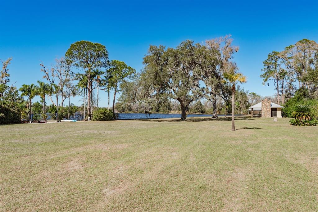 19018 Blake Road Odessa, FL 33556 - Photo 26 of 40 a front view of a building with large trees