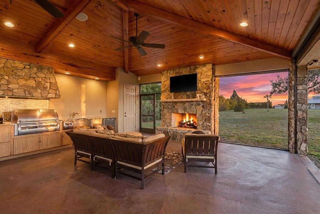 19018 Blake Road Odessa, FL 33556 - Photo 28 of 40 a outdoor space with the couches and dining table with the view