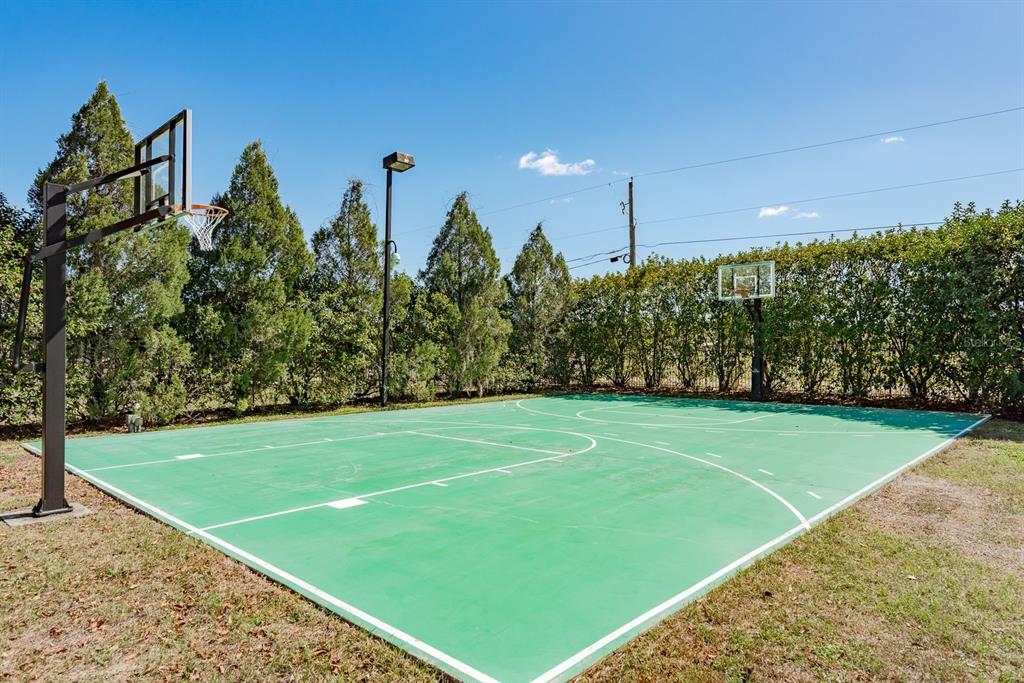 19018 Blake Road Odessa, FL 33556 - Photo 36 of 40 a view of a golf course with a trees