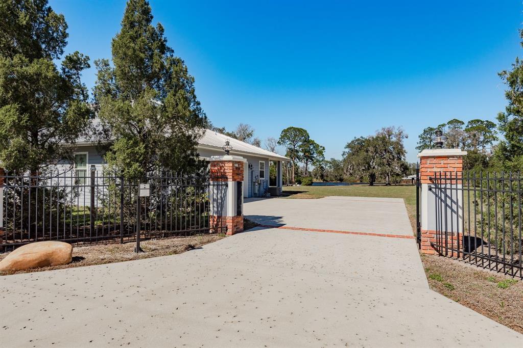 19018 Blake Road Odessa, FL 33556 - Photo 4 of 40 a view of a street with a building in the background