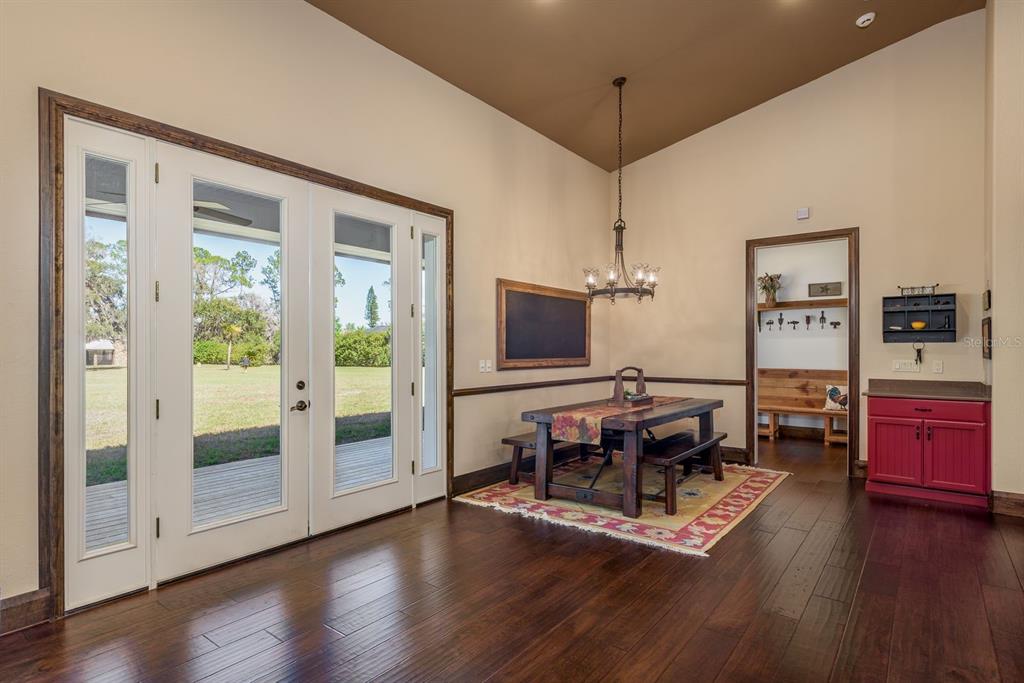 19018 Blake Road Odessa, FL 33556 - Photo 9 of 40 a living room with furniture flat screen tv and wooden floor