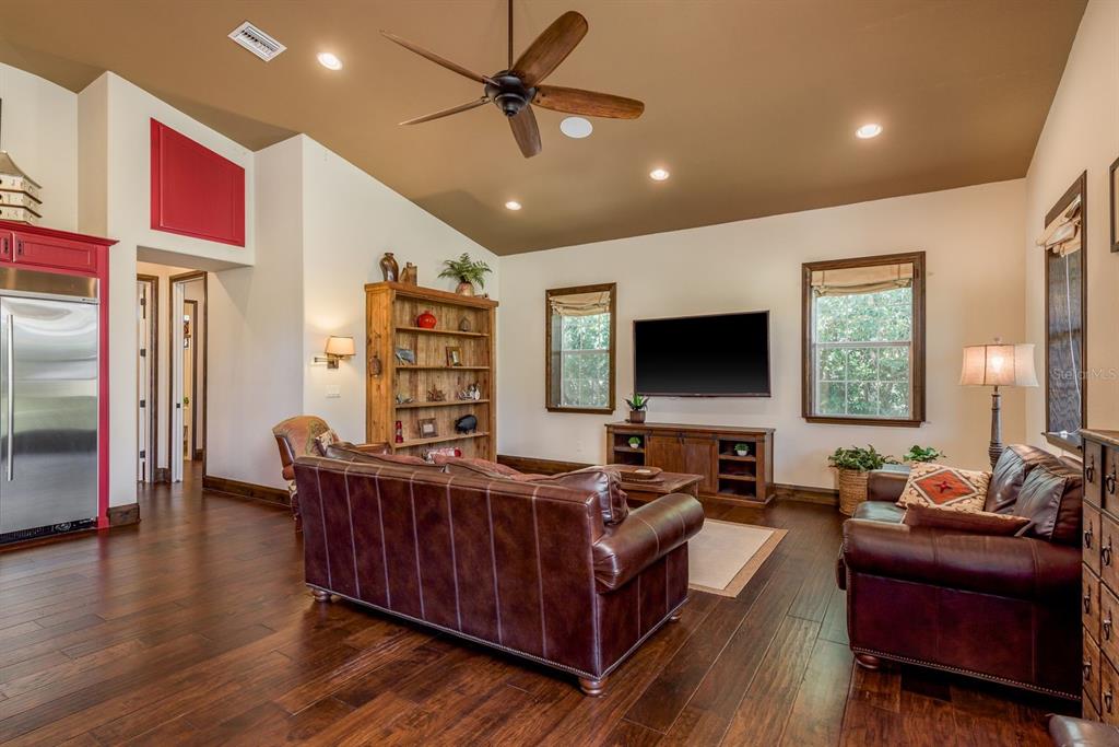 19018 Blake Road Odessa, FL 33556 - Photo 10 of 40 a living room with furniture and a flat screen tv