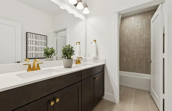 a bathroom with a sink a vanity and a mirror