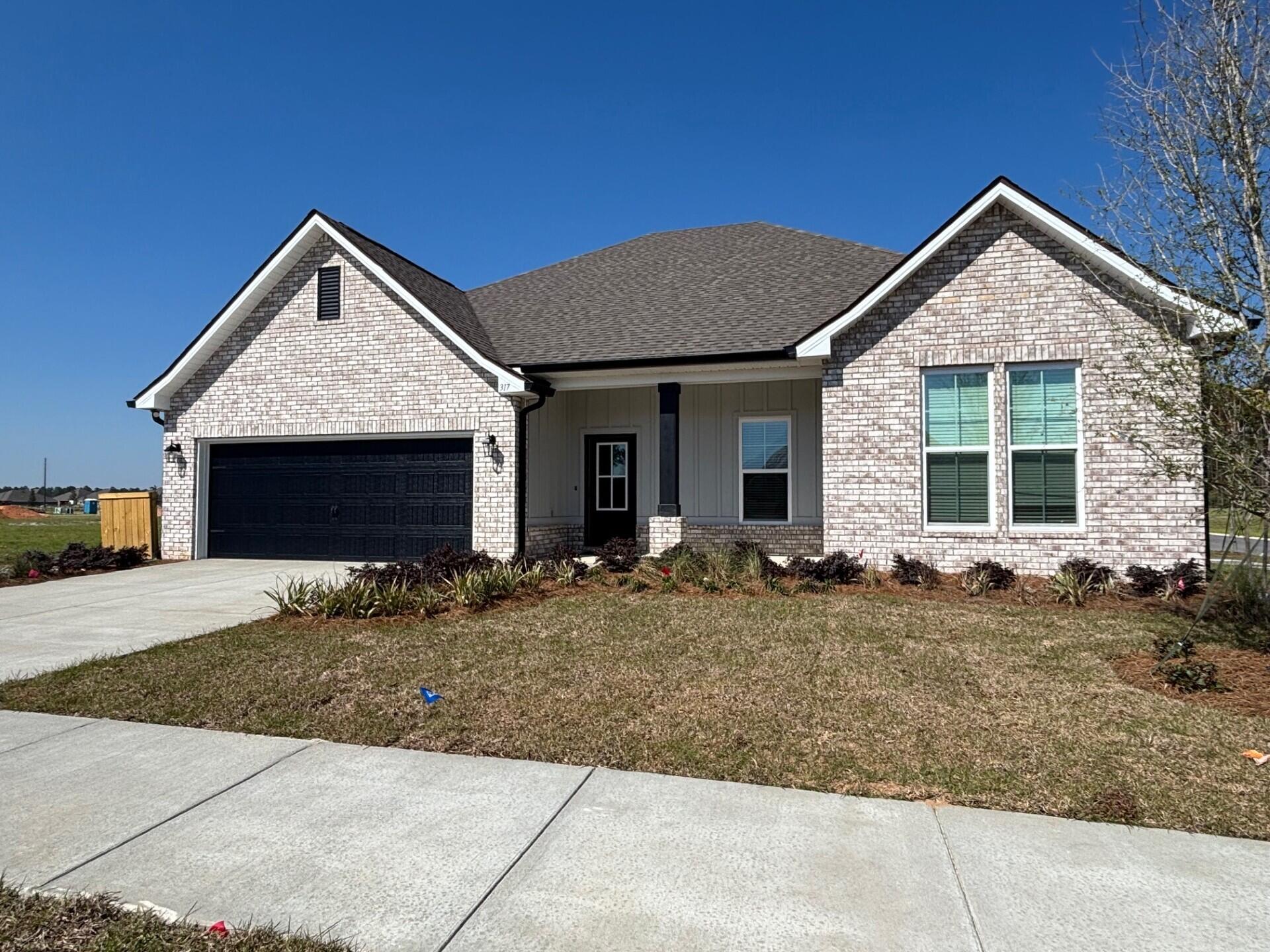 317 Splendor Run Ponce de Leon, FL 32455 - Photo 1 of 3 a front view of a house with entertaining space