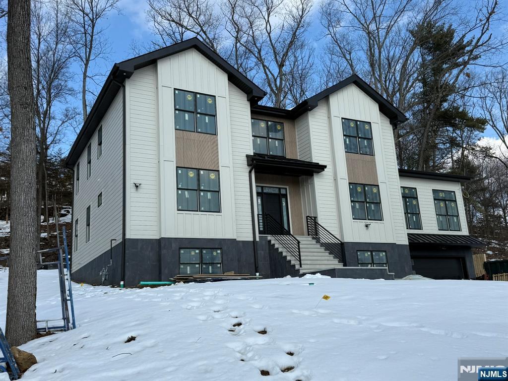 24 Peterson Road Wayne, NJ 07470 - Photo 1 of 31 a front view of a house with a yard