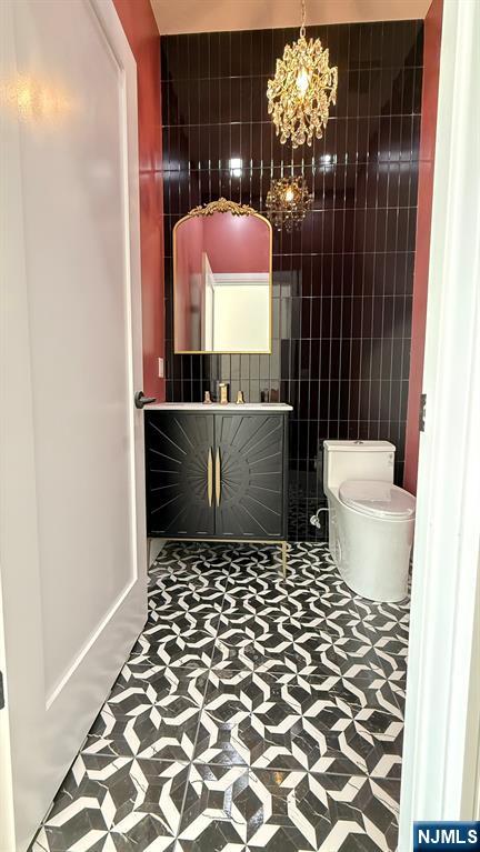 24 Peterson Road Wayne, NJ 07470 - Photo 11 of 31 a bathroom with a sink and a mirror