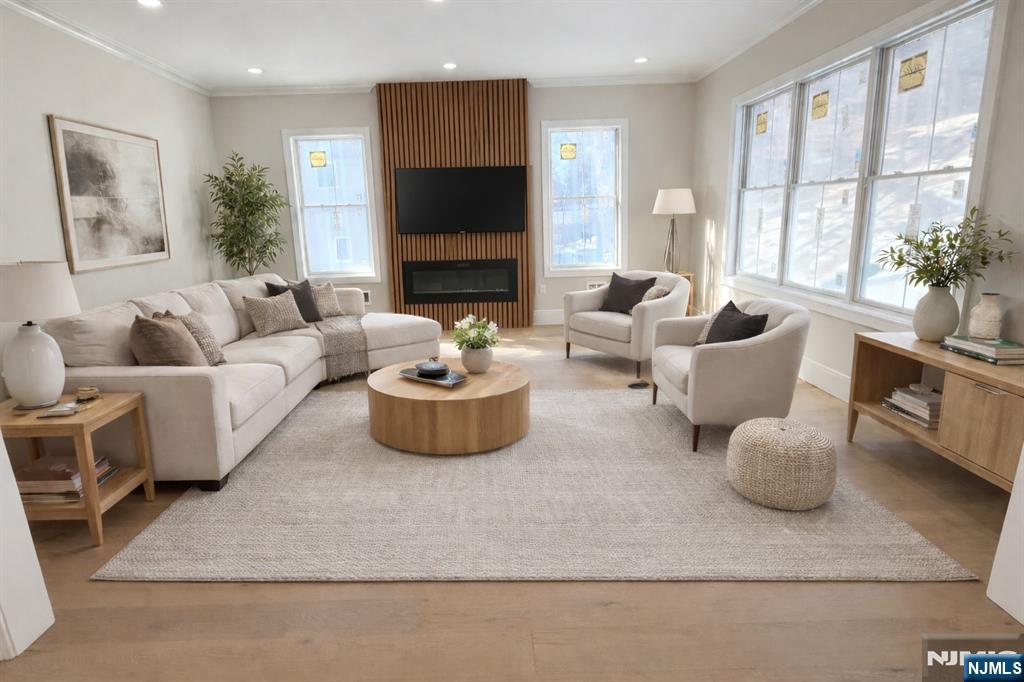 24 Peterson Road Wayne, NJ 07470 - Photo 13 of 31 a living room with furniture fireplace and a large window